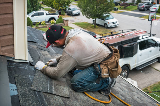 Professional Roofing technician working in Hampton Bays, NY